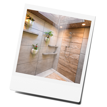 Luxurious bathroom renovation featuring a modern walk-in rain shower with a sky light, double vanity, and elegant tile work.